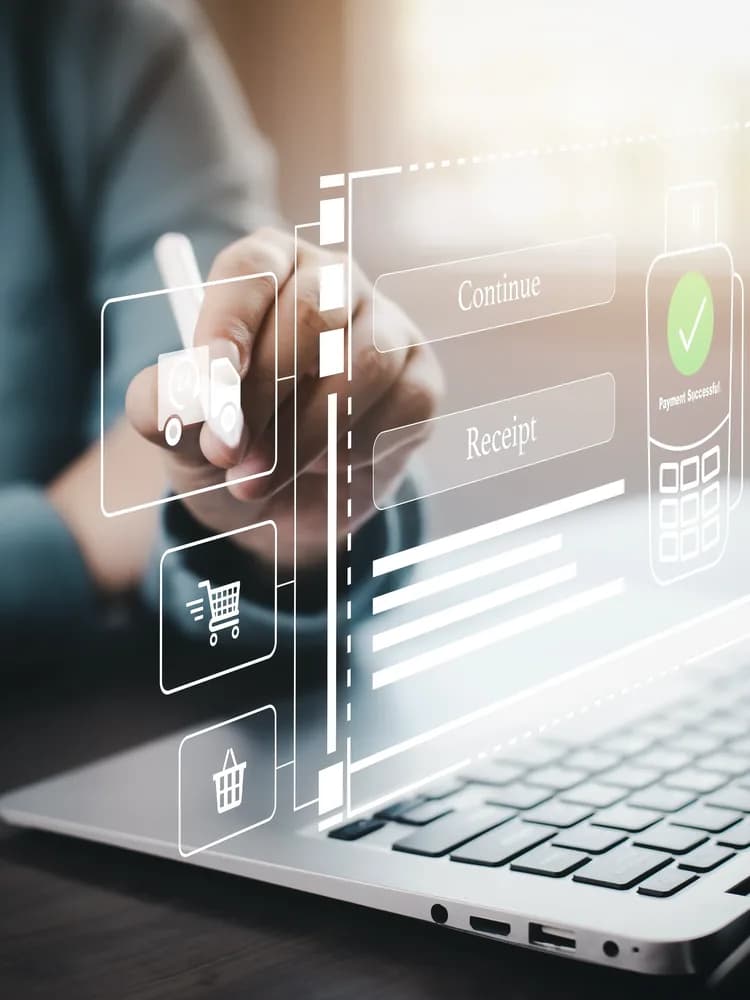 A phone showing a payment approved, a laptop and banking icons behind it