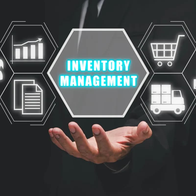 A hand holding an inventory management icon among supply-chain icons