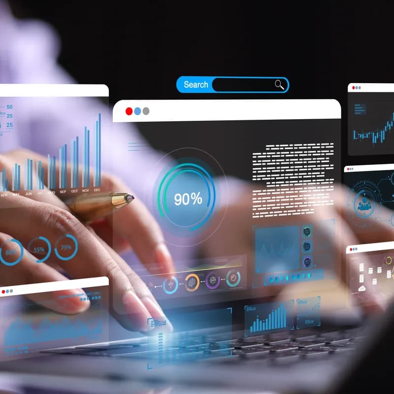 A businesswoman at a laptop with a floating interface panel