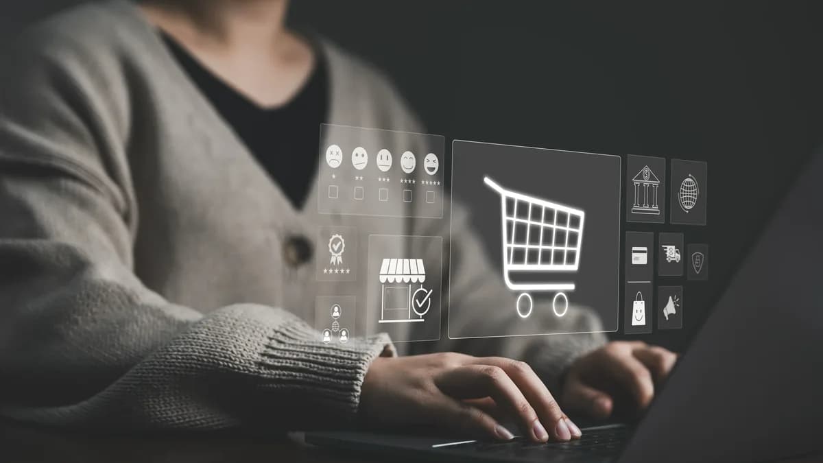 A shopper at a laptop, shopping icons floating over the keyboard