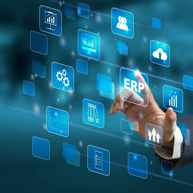 A businessman touching an ERP icon on a virtual screen