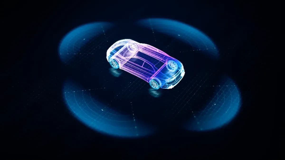 Glowing wireframe model of a car on a dark scanning grid.